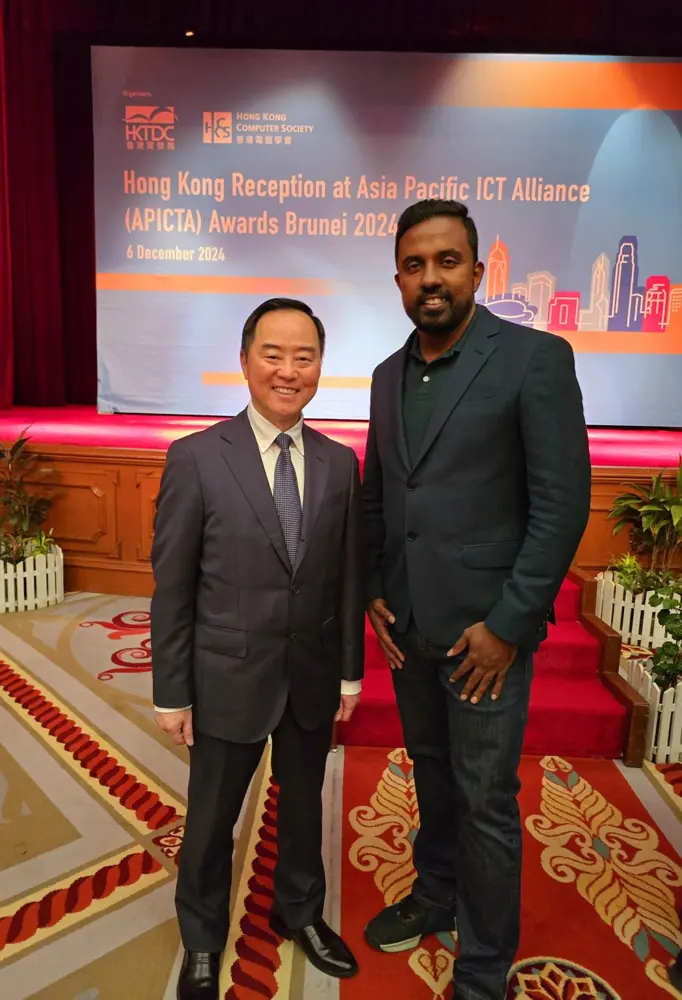 Sanjeewa and Tony Wong photographed at a Hong Kong technology event.
