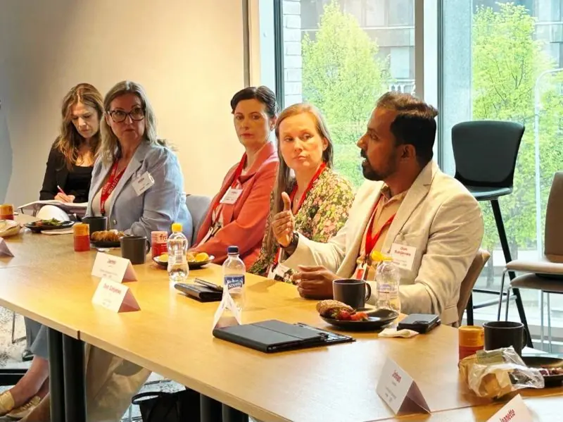 Sanjeewa contributing to a roundtable discussion at AmCham Finland.