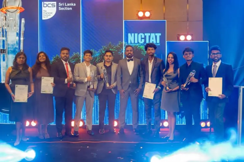 Team members on stage with awards and certificates at NBQSA 2026.