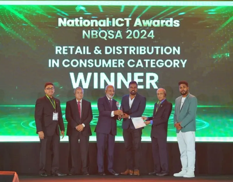 Award presentation beneath the NBQSA 2024 Retail & Distribution winner display.